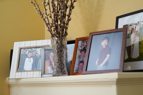 Pictures of Robert Onofry's family members at his home in Port Jervis, N.Y., on Feb. 1, 2023. (Cara Ding/The Epoch Times)