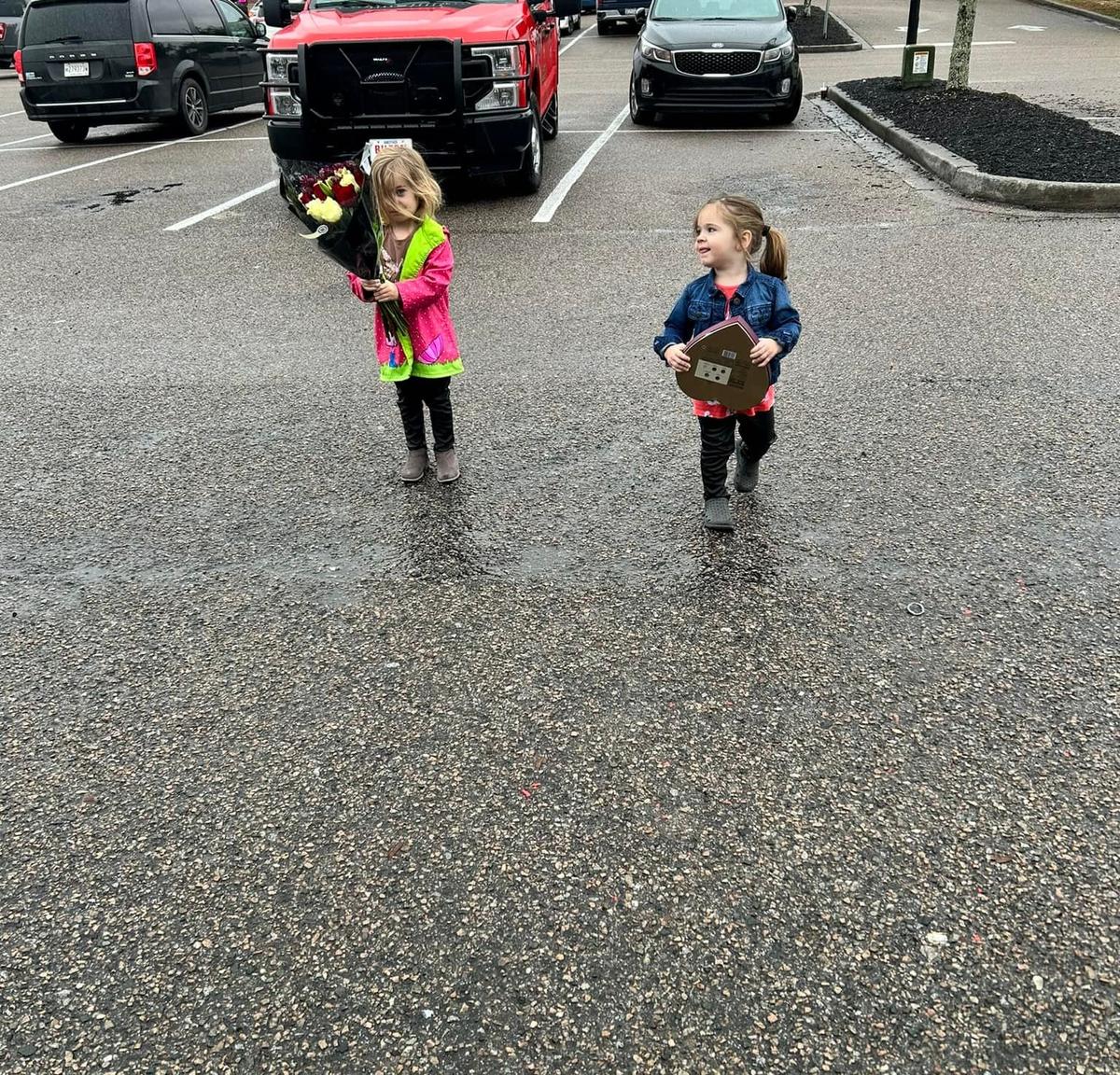 Lacey and Kevin's kids deliver flowers and candy to Gillespie. (Courtesy of Lacey Keighron)