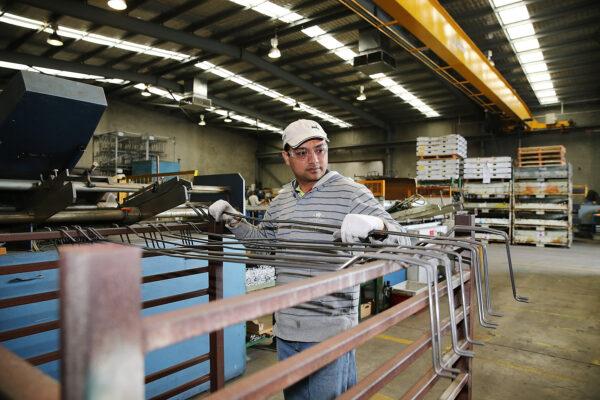 An employee works at the Multi Slide Industries manufacturing plant in Adelaide, Australia, on Aug. 12, 2013. (Morne de Klerk/Getty Images)