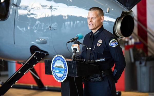 Huntington Beach Police Chief Eric Parra speaks at the release of the department's newest MD 530 F patrol helicopter in Huntington Beach, Calif., on Feb. 8, 2023. (John Fredricks/The Epoch Times)