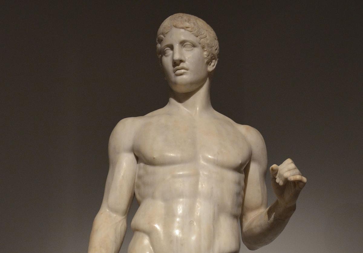 The canon of Polykleitos (aesthetic canon of proportion) is best represented in his Doryphoros or "Spear-bearer" from the fifth century B.C. (Cropped photo by <a href="https://commons.wikimedia.org/wiki/File:A_well-preserved_Roman_period_copy_of_the_Doryphoros_of_Polykleitos_cast_circa_440_BC,_from_the_time_of_Tiberius_(14-37_AD),_found_in_Pompeii,_Moi,_Auguste,_Empereur_de_Rome_exhibition,_Grand_Palais,_Paris.jpg">Following Hadrian</a>/<a href="https://creativecommons.org/licenses/by-sa/2.0/deed.en">CC BY-SA 2.0</a>)