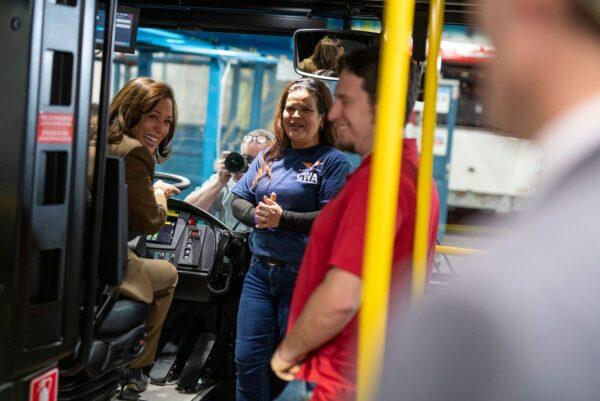 U.S. Vice President Kamala Harris sits in the driver’s seat of a bus as tours the production facility of manufacturer New Flyer in St. Cloud, Minn., on Feb. 9, 2023. (Stephen Maturen/AFP via Getty Images)