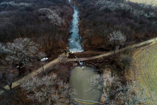 Cleanup continues in the area where the ruptured Keystone pipeline dumped oil into a creek in Washington County, Kan., on Dec. 9, 2022. (DroneBase via AP)