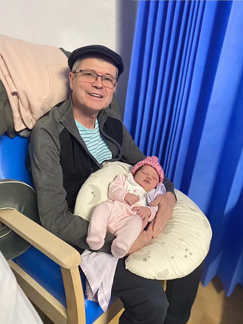 Edward is holding his grandkid Amelia for the first time. (Courtesy of <a href="https://www.instagram.com/lucygemmaogrady/">Lucy Watts</a>)