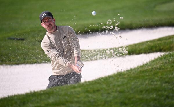 Nick Taylor of Canada plays a shot from a bunker on the second hole during the final round of the AT&T Pebble Beach Pro-Am at Pebble Beach Golf Links in Pebble Beach, Calif., on Feb. 5, 2023. (Orlando Ramirez/Getty Images)