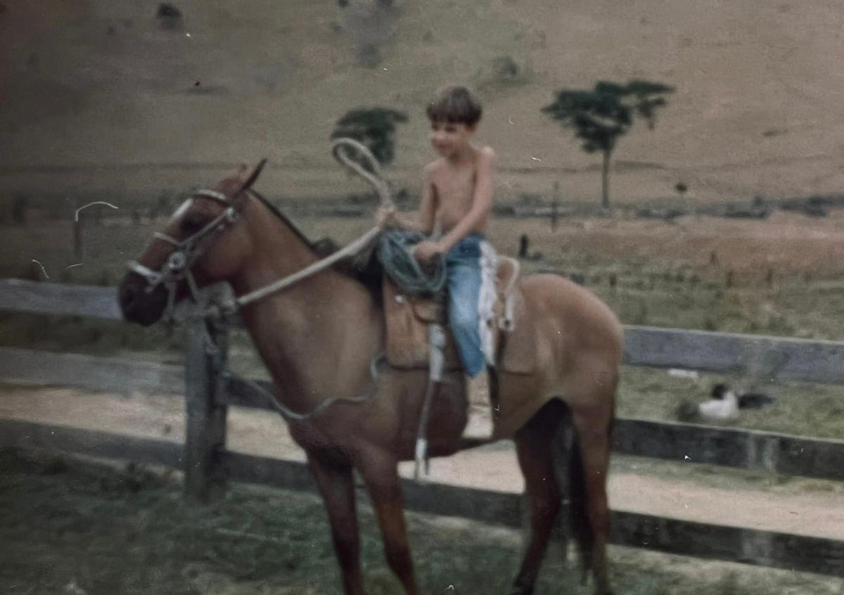A childhood photo of Tony and one of his farm horses. (Courtesy of <a href="https://www.instagram.com/tonymendesphotography/">Tony Mendes</a>)