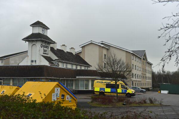 Police outside the Suites Hotel in Knowsley, Merseyside, England, on Feb. 11, 2023. (Peter Powell/PA Media)
