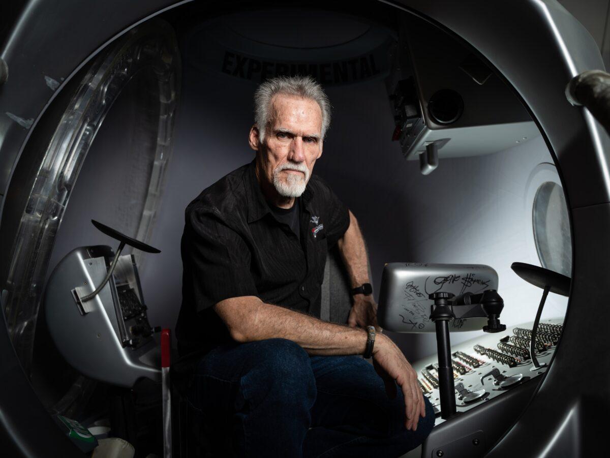 Art Thompson, CEO of Sage Cheshire and president of A2ZFX, sits inside a model capsule he built for Red Bull Stratos in Lancaster, Calif., on Aug. 13, 2022. (Samira Bouaou/The Epoch Times)