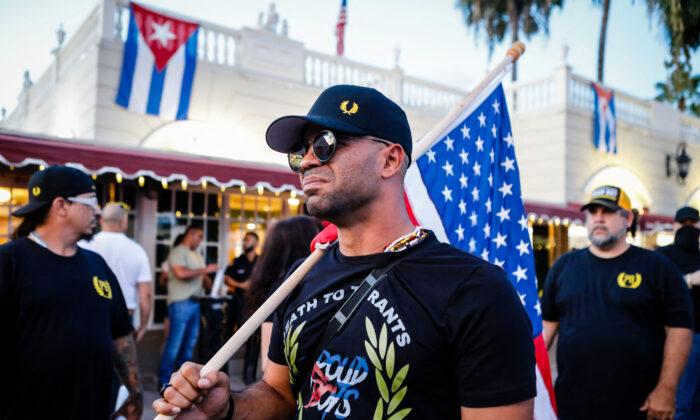 Henry “Enrique” Tarrio, leader of The Proud Boys, holds a U.S. flag during a protest showing support for Cubans demonstrating against their government in Miami on July 16, 2021. (Eva Marie Uzcategui/AFP via Getty Images)