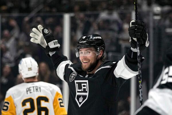 Los Angeles Kings right wing Adrian Kempe celebrates after scoring his third goal of the game for a hat trick during the second period of an NHL hockey game against the Pittsburgh Penguins Saturday, Feb. 11, 2023, in Los Angeles. (AP Photo/Mark J. Terrill)