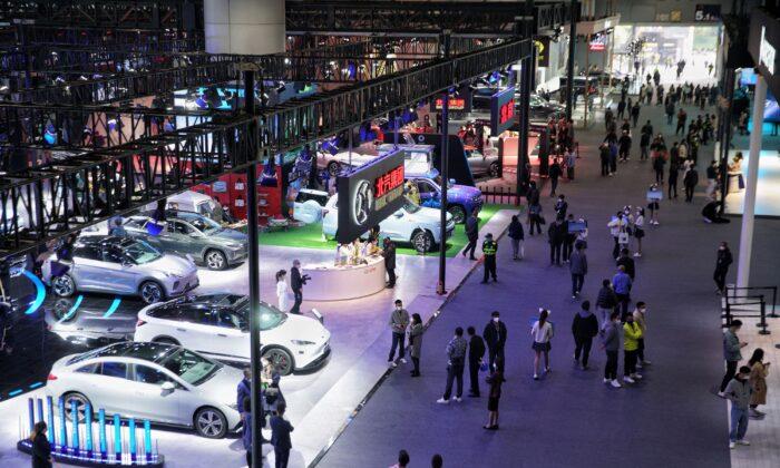 People visit the 20th Guangzhou International Automobile Exhibition on its opening day in Guangzhou, in China's southern Guangdong Province, on Dec. 30, 2022. (STR/AFP via Getty Images)