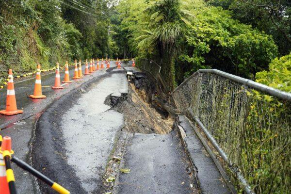 A general view of a damaged road after a storm battered Titirangi, a suburb of New Zealand's West Auckland area, on Feb. 13, 2023. (Diego Opatowski/AFP via Getty Images)