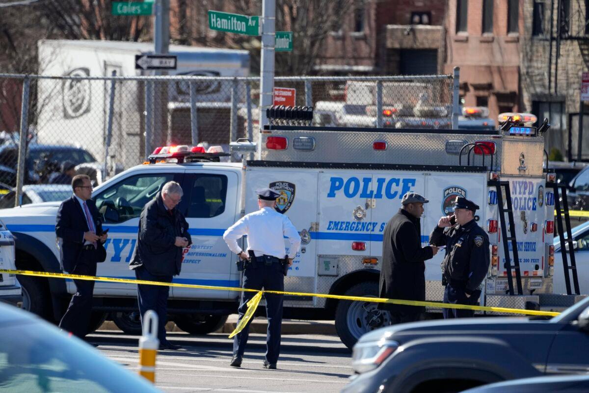New York Police gather at the scene where a rental truck was stopped and the driver arrested in New York on Feb. 13, 2023. (John Minchillo/AP Photo)