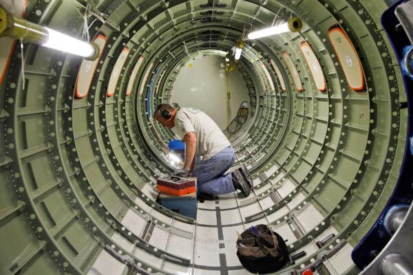 Cessna employee Dwight Bennett works inside of a jet during a tour of the Cessna business jet assembly line at their manufacturing plant in Wichita, Kan., on Aug. 14, 2012. (Jeff Tuttle/Reuters)