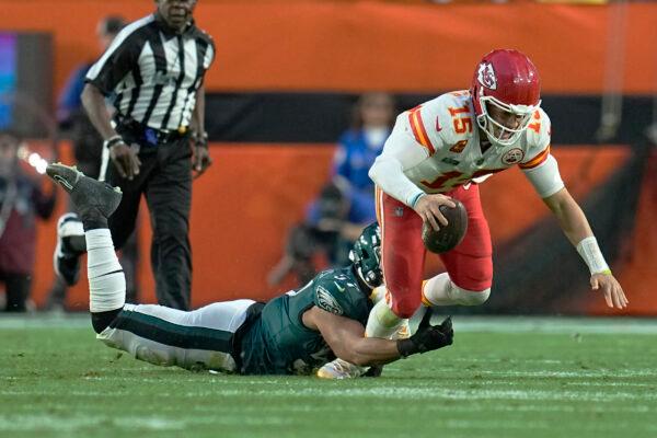 Kansas City Chiefs quarterback Patrick Mahomes (15) is tackled by Philadelphia Eagles linebacker T.J. Edwards (57) during the first half of the NFL Super Bowl 57 football game, in Glendale, Ariz., on Feb. 12, 2023. (Abbie Parr/AP Photo)