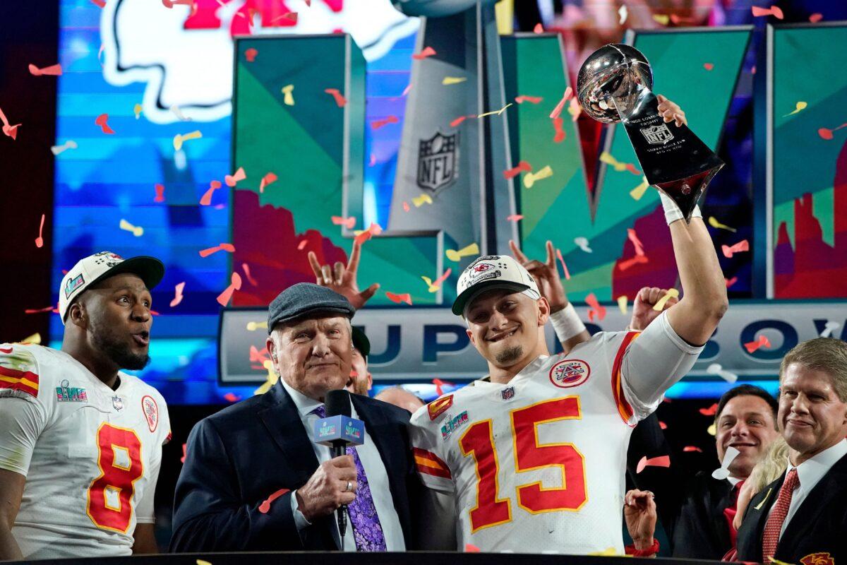 Retired football player Terry Bradshaw (C) stands with Kansas City Chiefs' quarterback Patrick Mahomes (R) and Kansas City Chiefs' defensive end Carlos Dunlap as they celebrate their team's winning Super Bowl LVII against the Philadelphia Eagles at State Farm Stadium in Glendale, Ariz., on Feb. 12, 2023. (Timothy A Clary/AFP via Getty Images)