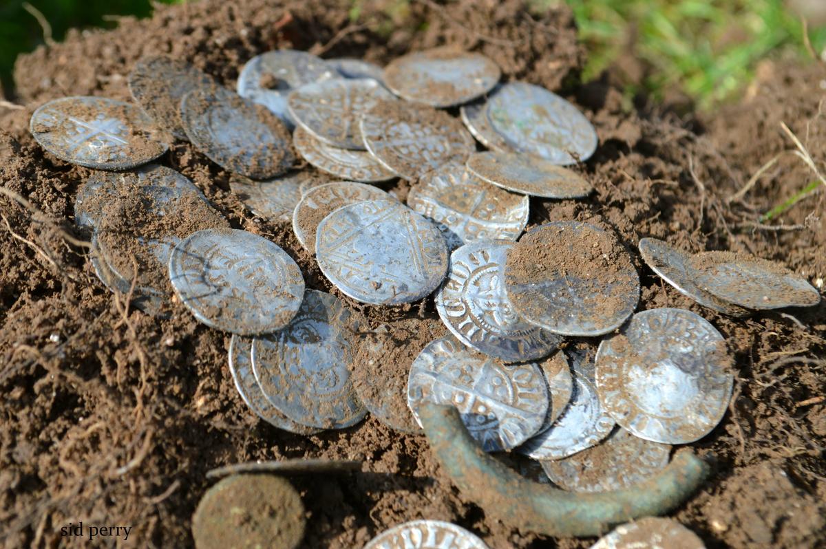 A pile of silver pennies from the reigns of Edward I and II were found among the 627 coins at the Culden Faw Estate in Buckinghamshire. (SWNS)