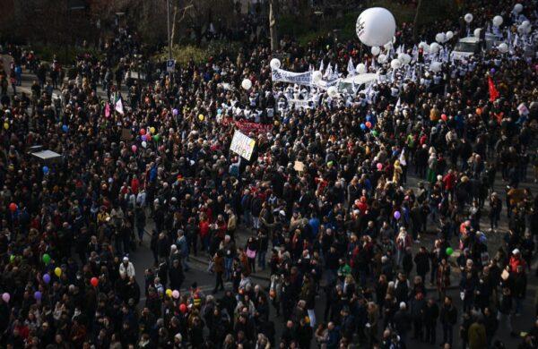 Protesters attend a demonstration on the fourth day of nationwide rallies organised since the start of the year against a deeply unpopular pensions overhaul in Paris on Feb. 11, 2023. (Christophe Archambault/AFP via Getty Images)