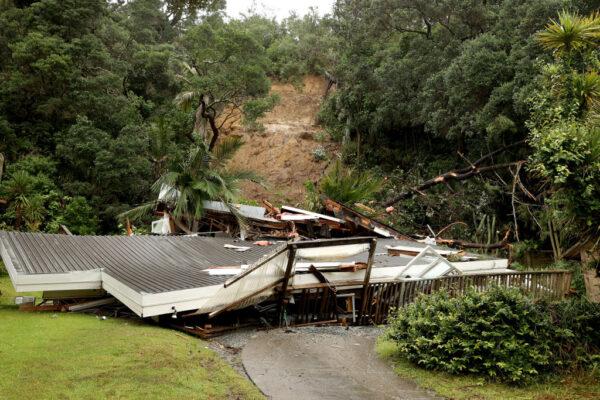 A house sits destroyed at the bottom of a large landslide on Domain Crescent in Muriwai following Cyclone Gabrielle in Auckland, New Zealand, on Feb. 14, 2023. (Phil Walter/Getty Images)