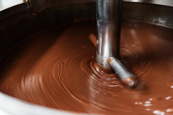 The cacao nibs are ground into a thick, liquid paste called cocoa mass or cocoa liquor— what is then made into the chocolate we know and love.（Courtesy of Lydgate Farms）