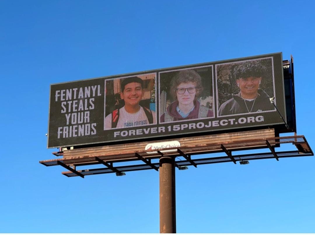 A billboard in Kyle, Texas, features three Hays CISD students who died from fentanyl poisonings in July and August of 2022. (Courtesy of Forever15Project.org)