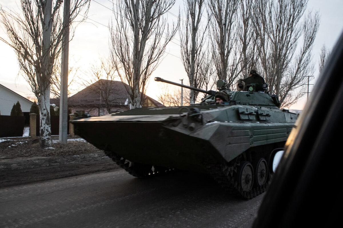 Ukrainian servicemen drive along a street with BMP-2 infantry fighting vehicle in the frontline town of Bakhmut, Ukraine, on Feb. 9, 2023. (Yevhenii Zavhorodnii/Reuters)