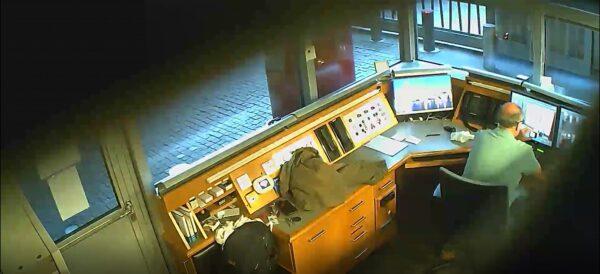 An undated image of David Smith filming the CCTV monitors in the security kiosk at the British Embassy in Berlin, Germany, in 2021. (Metropolitan Police).