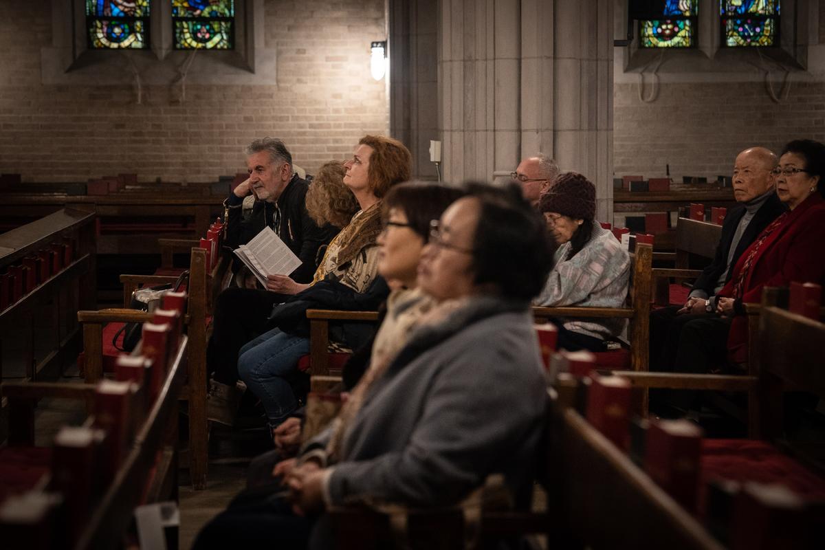 Audience members listen to Salvatore Pronestì's organ recital at the Cadet Chapel at West Point, N.Y., on Feb. 12, 2023. (Samira Bouaou/The Epoch Times)