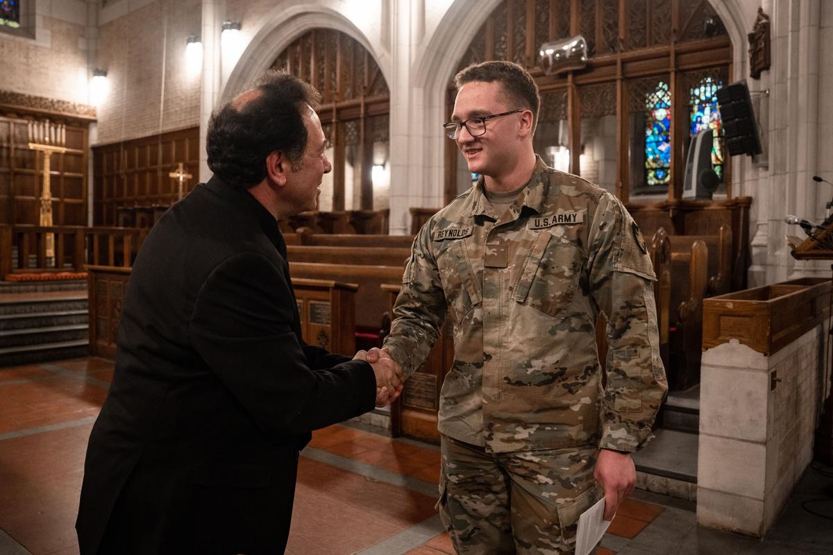 Salvatore Pronestì greets audience members after his organ recital at the Cadet Chapel at West Point, N.Y., on Feb. 12, 2023. (Samira Bouaou/The Epoch Times)