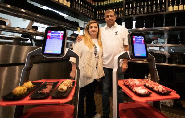 Beran Karaaslan (L) and Esat Karaaslan at I Can Korean Barbeque in Tustin, Calif., on Feb. 14, 2023. (John Fredricks/The Epoch Times)