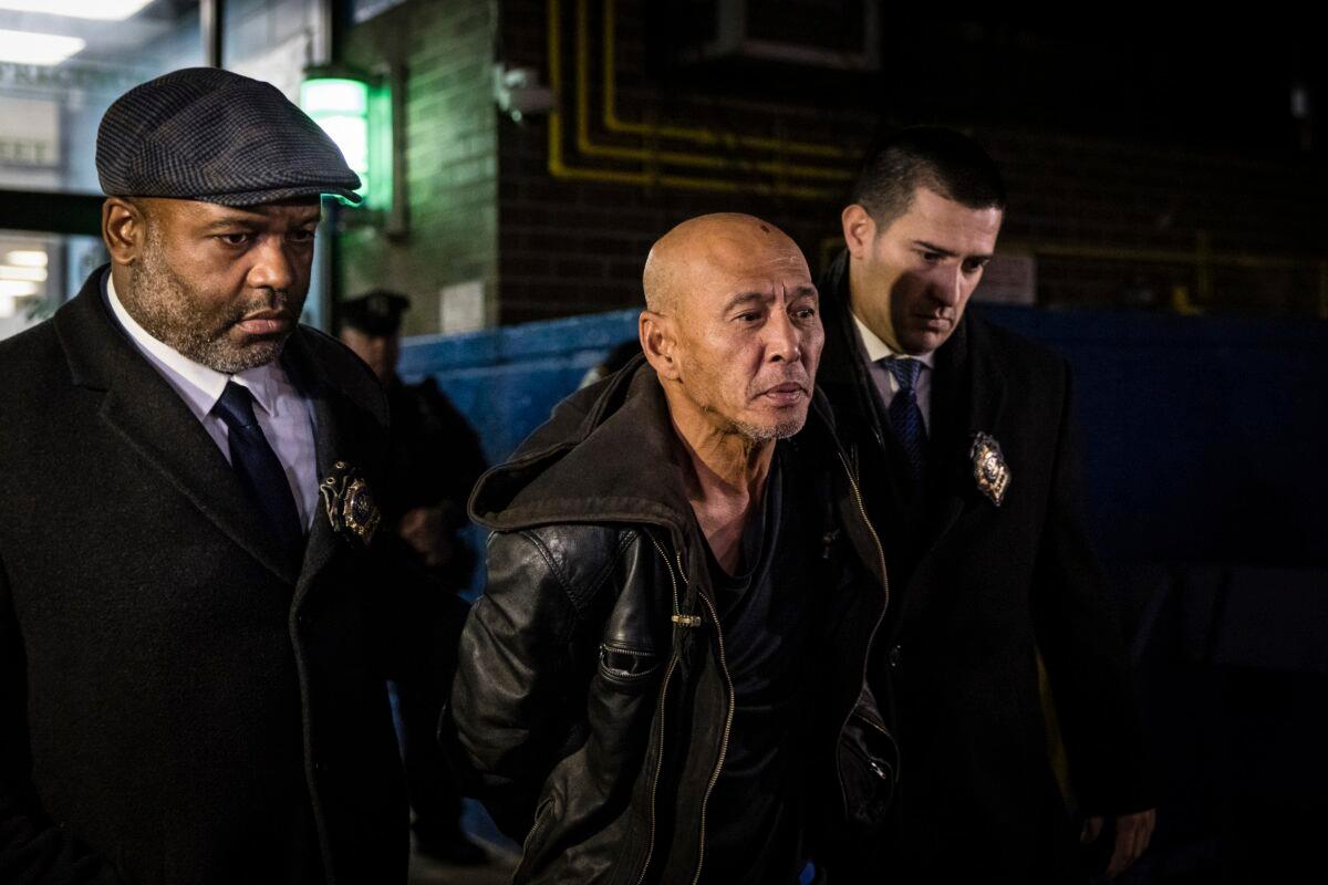 Weng Sor is walked by New York Police Department detectives out of the 68th Precinct in the Brooklyn borough of New York on Feb. 14, 2023. (Stefan Jeremiah/AP Photo)