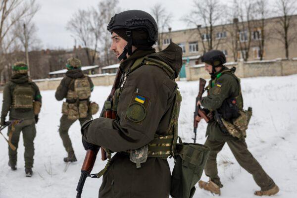 Ukrainian soldiers patrol in Bakhmut, eastern Ukraine, on Feb. 14, 2023. (John Moore/Getty Images)