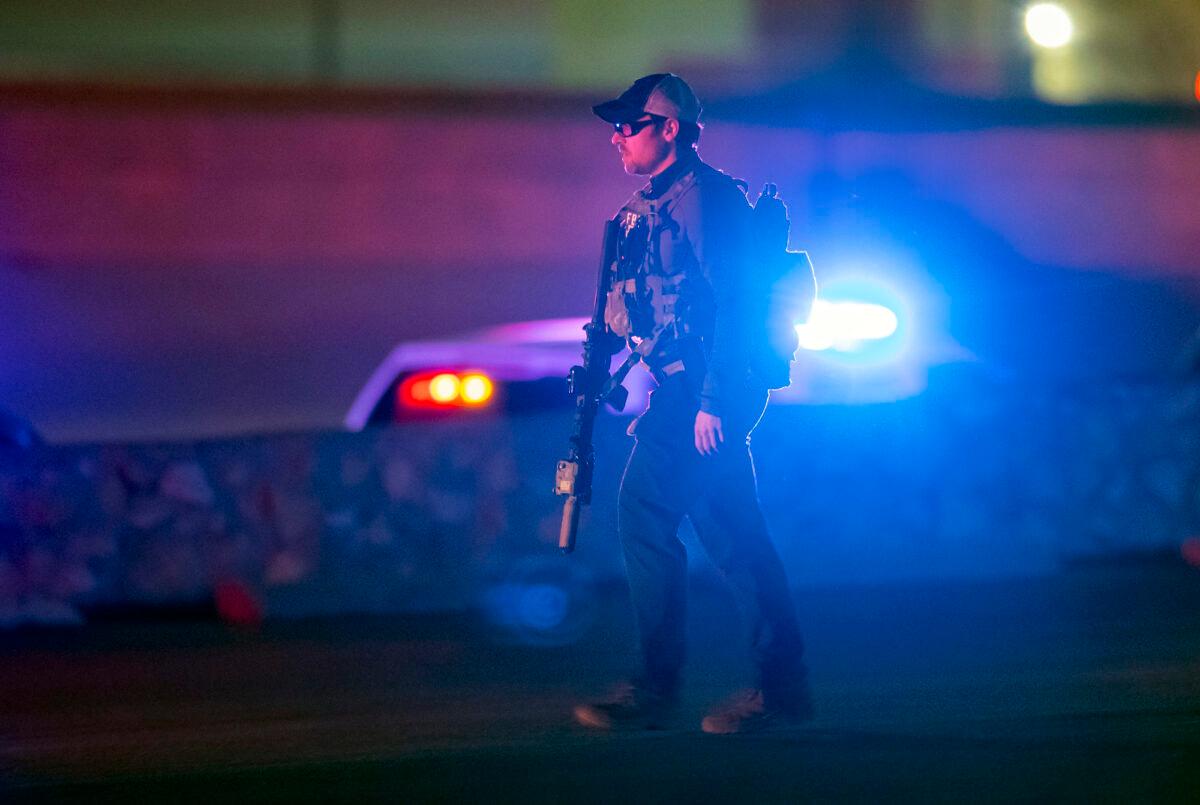 An FBI agent walks outside the Cielo Vista Mall in El Paso, Texas, on Feb. 15, 2023. (Andrés Leighton/AP Photo)