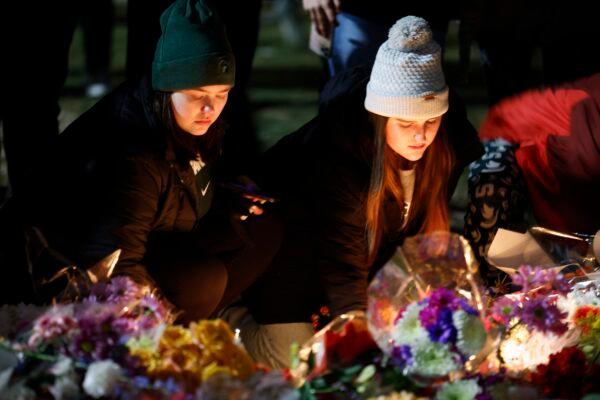 Mourners attend a vigil at The Rock on the grounds of Michigan State University in East Lansing, Mich., on Feb. 15, 2023. (Al Goldis/AP Photo)