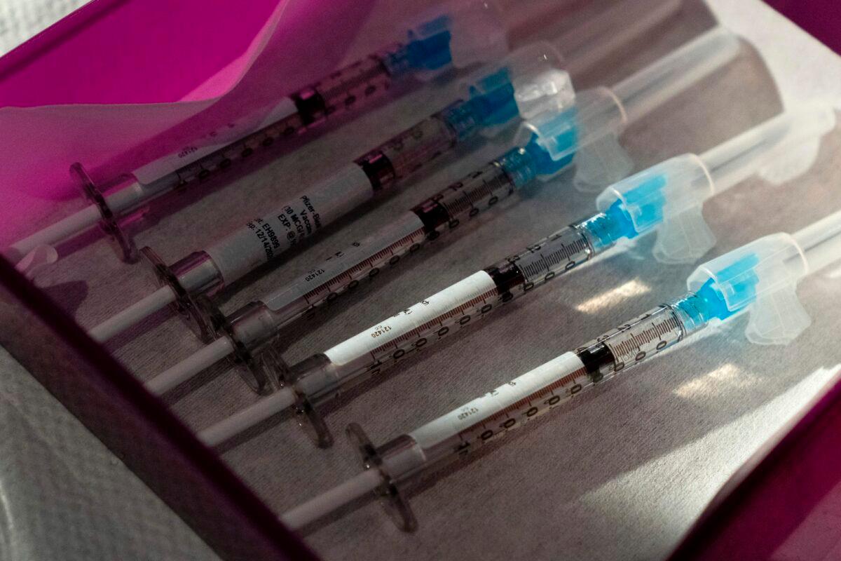 COVID-19 vaccines at George Washington University Hospital in Washington in a Dec. 14, 2020, file photograph. (Jacquelyn Martin/Pool/AFP via Getty Images)