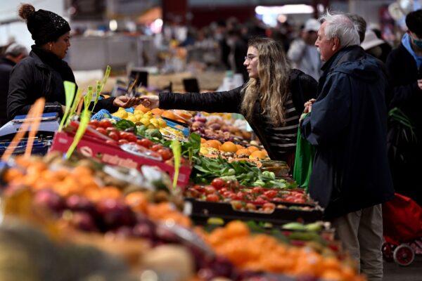 People shop for fruit and vegetables at Victoria Market in Melbourne, Australia, on July 5, 2022. (William West/AFP via Getty Images)