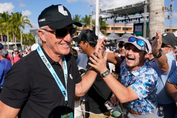 LIV Golf CEO Greg Norman (L) walks off the course after the final round of the LIV Golf Team Championship at Trump National Doral Golf Club, in Doral, Fla., on Oct. 30, 2022. (Lynne Sladky/AP Photo)