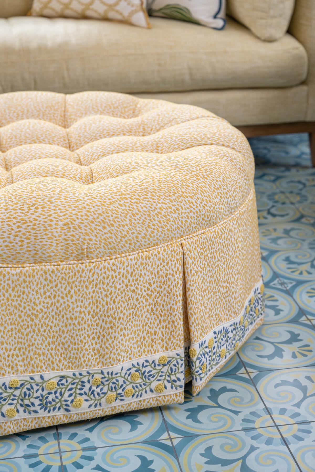 This ottoman features tape trim, a powerful detail that helps pull the space together. (Handout/TNS)