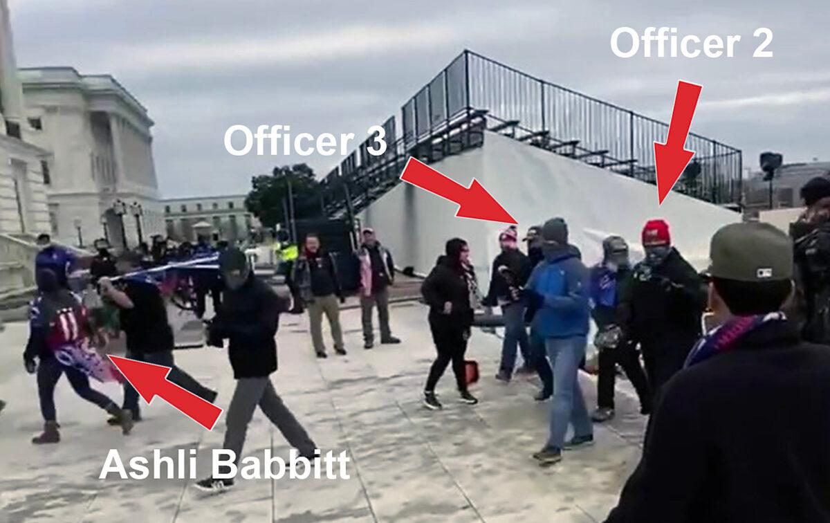 Two undercover Metropolitan Police Department officers walk behind Ashli Babbitt on the northwest side of the Capitol on Jan. 6, 2021. (William Pope via U.S. District Court/Screenshot via The Epoch Times)