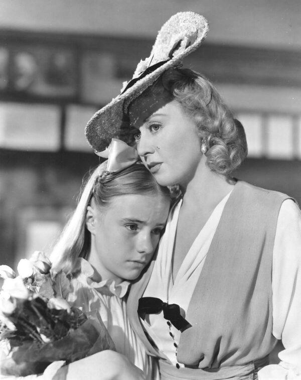 Francie (Peggy Ann Garner, L) is consoled by her aunt Sissy (Joan Blondell), in "A Tree Grows in Brooklyn." (20th Century Fox)