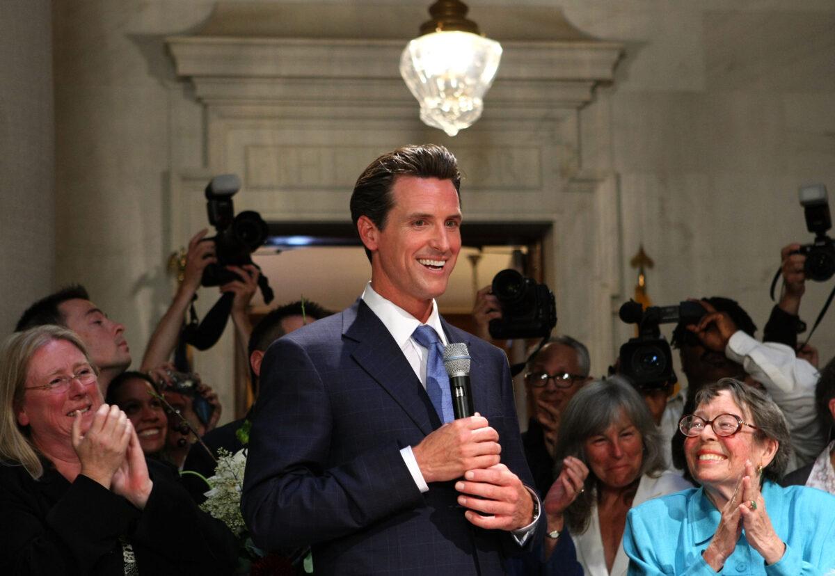 San Francisco mayor Gavin Newsom speaks to reporters after he married a same-sex couple in a private ceremony at San Francisco City Hall in San Francisco on June 16, 2008. (Justin Sullivan/Getty Images)