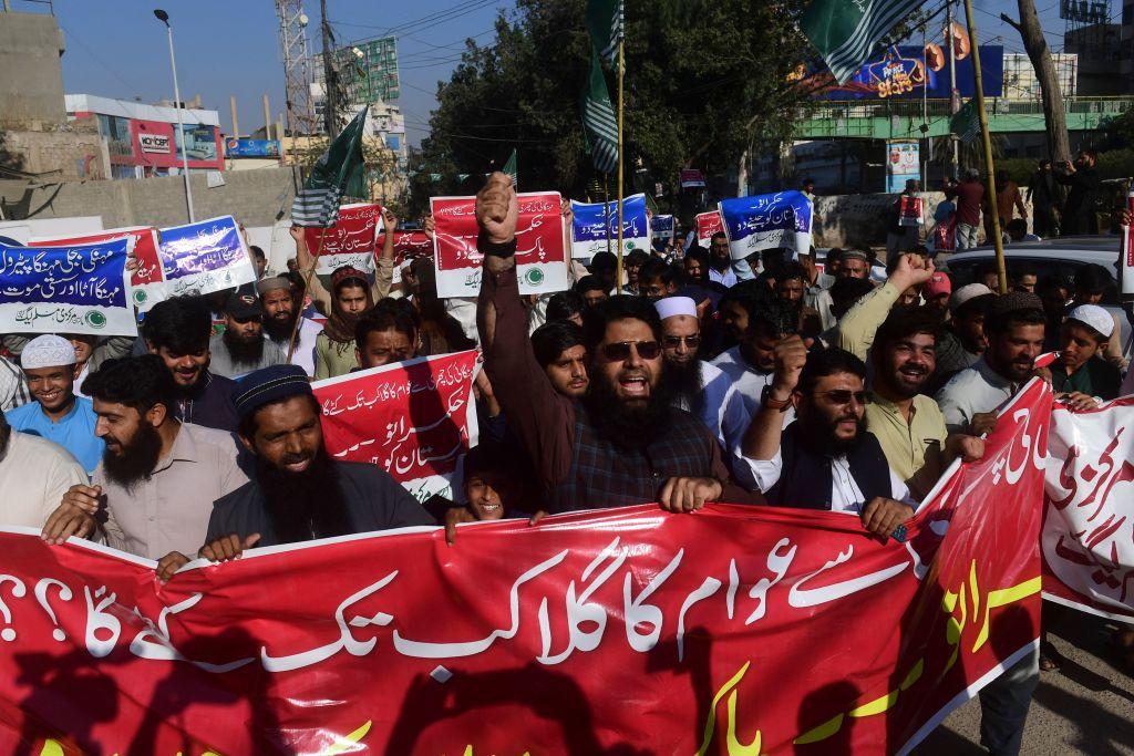 Activists of the Pakistan Markazi Muslim League (PMML) carry placards and chant anti-government slogans during a protest against the inflation and price hike in commodity items and oil products, in Karachi, on Feb. 17, 2023. ( Asif Hassan/AFP via Getty Images)