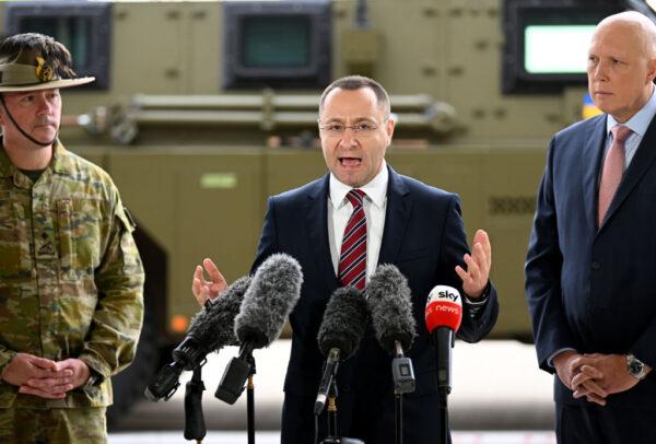 Ambassador of Ukraine to Australia Vasyl Myroshnychenko (C), joined by former Australian Defence minister Peter Dutton (R), speaks during a press conference at the Amberley Air Base in Ipswich, Australia, on April 8, 2022. (Dan Peled/Getty Images)