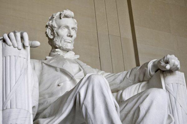 The stoic depiction of Lincoln is heightened by the atmospheric lighting in the temple. (Shutterstock)