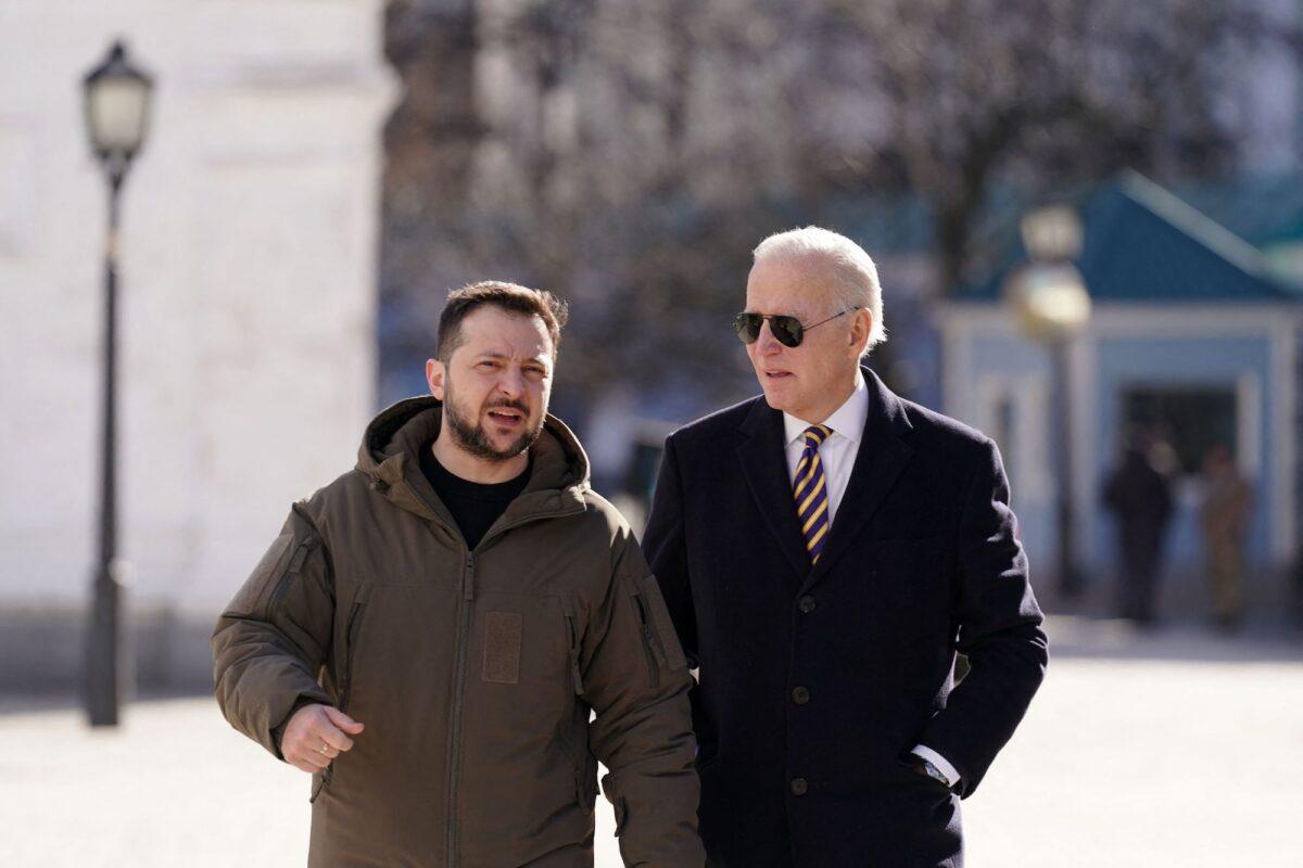 President Joe Biden (R) walks next to Ukrainian President Volodymyr Zelenskyy (L) as he arrives for a visit in Kyiv, Ukraine, on Feb. 20, 2023. (Dimitar Dilkoff/AFP/Getty Images)