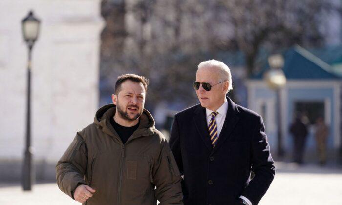 President Joe Biden (R) walks next to Ukrainian President Volodymyr Zelenskyy (L) as he arrives for a visit in Kyiv, Ukraine, on Feb. 20, 2023. (Dimitar Dilkoff/AFP/Getty Images)