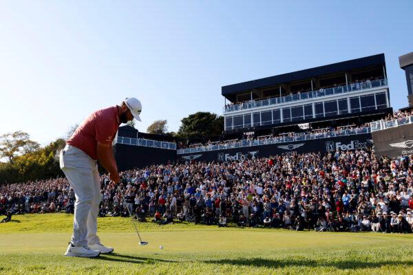 Jon Rahm putts on the 18th green during the final round of the Genesis Invitational golf tournament at Riviera Country Club in the Pacific Palisades area of Los Angeles on Feb. 19, 2023. (Ryan Kang/AP Photo)