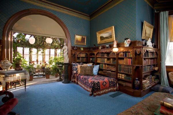 Not surprising is the fact that the Clemens’s library was a centerpiece of the elaborate home. Approximately 1,200 books are shelved in the lavishly carved bookcases. The room is outfitted with comfortable upholstery, including a daybed, and bedecked with original art, most of which was not owned by the Clemens family but is similar to paintings of the time period that they would have owned. (Courtesy of the Mark Twain House)