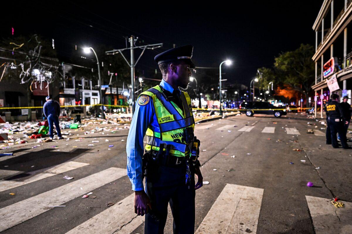 Police officers work at the scene of a shooting that occurred during the Krewe of Bacchus parade in New Orleans, Louisiana, on Feb. 19, 2023. (Chandan Khanna/AFP/Getty Images)