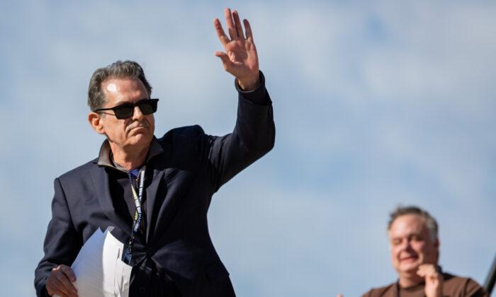 Comedian Jimmy Dore waves to the crowd at the "Rage Against the War Machine" rally in Washington on Feb. 19, 2023. (Courtesy of "Rage Against the War Machine")